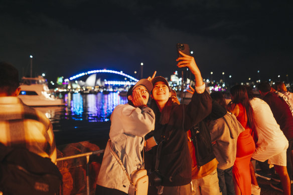 Crowds enjoy Sydney Harbour.