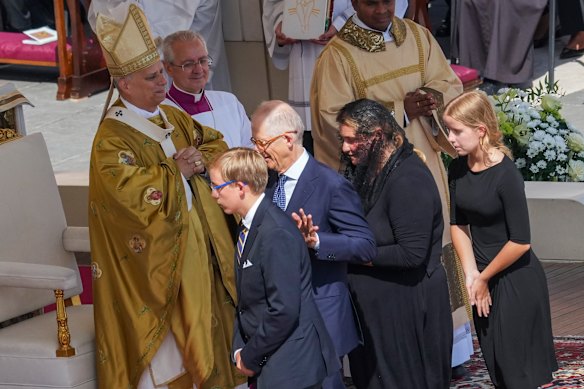 The family of Carlo Acutis attend the canonisation mass celebrated by Pope Leo XIV, left.