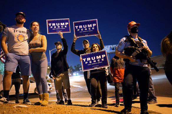 Supporters of President Donald Trump protest the Nevada vote in front of the Clark County Election Department in Las Vegas.