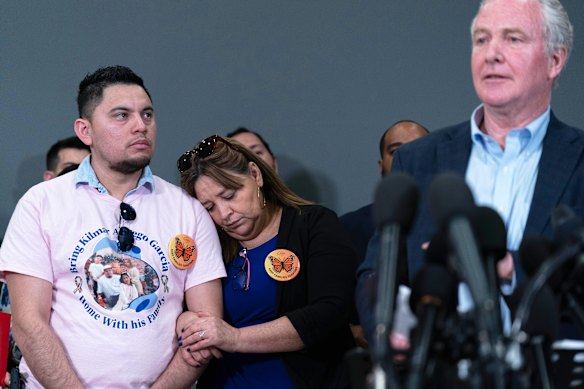 Van Hollen, right, at his press conference with Garcia’s brother Cesar and mother Cecilia at Dulles International Airport on Friday.