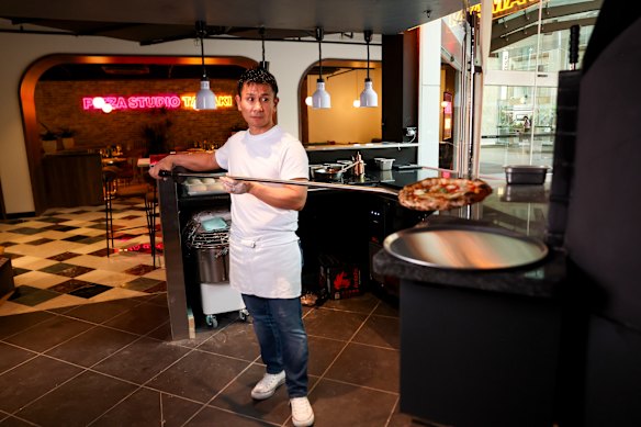 Tamaki tests his new Sydney oven, three days before opening. 