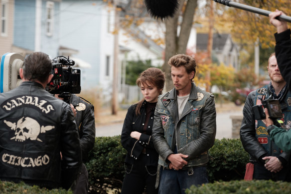 Jodie Comer and actor Austin Butler on the set of The Bikeriders. Many of the film’s scenes recreate photos from Danny Lyons’ book. 