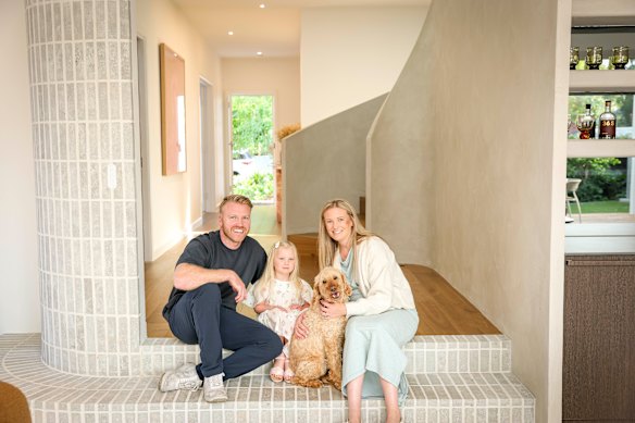 Mitch and Corinne Pryor with their daughter Audrey and their dog Bentley, whose home is featured in Grand Designs: Transformations and is currently for sale.