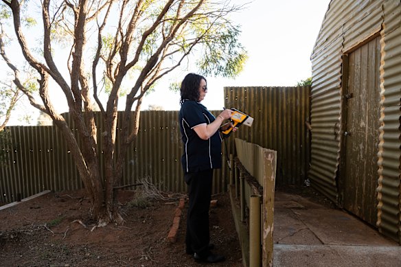 Renee Morrison of Maari Ma Health Aboriginal Corporation tests a family’s backyard for lead. 