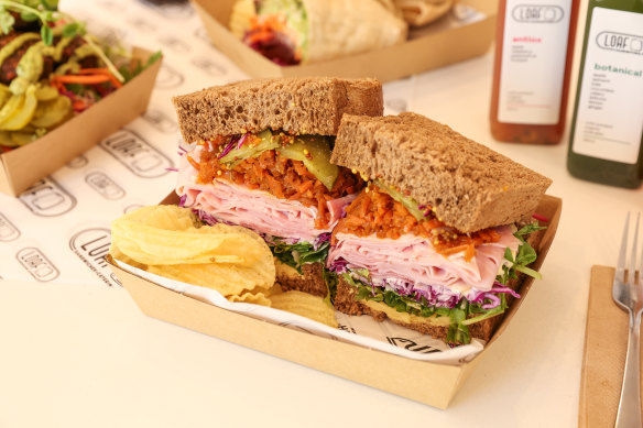 The Hambo sandwich featuring shaved ham, caramelised carrot, strong cheddar, red cabbage, pickles, truffle mayonnaise, lettuce and seeded mustard.
