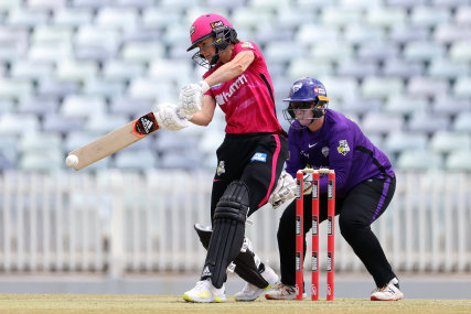 Sixers captain Ellyse Perry cuts loose against the Hurricanes on Wednesday.