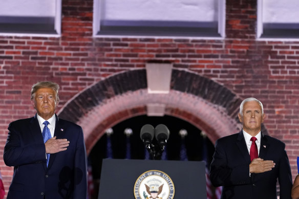 US President Donald Trump and Vice-President Mike Pence stand for the national anthem on the third day of the Republican National Convention.