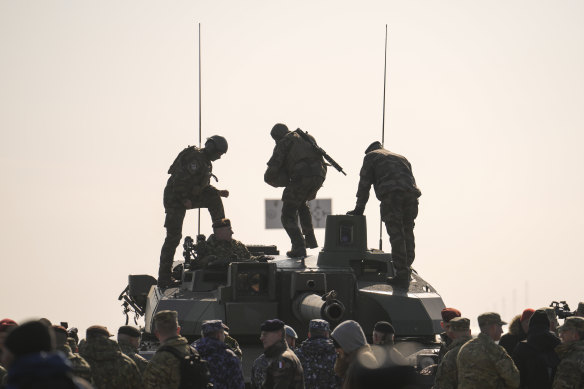 French servicemen stand on a tank during a joint US-French exercise in Romania in January. 
