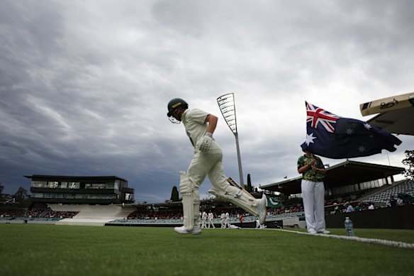 Marcus Harris takes the field for the PM’s XI.