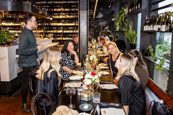 Guest enjoying dinner at the Wine Merchant. 