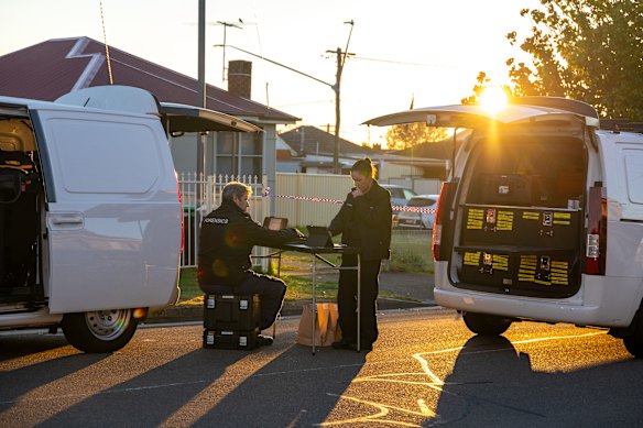 Forensic officers at Canley Heights on Wednesday.