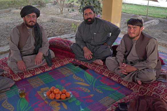 Tribal elder Hamidi, centre, with two of Haji Sardar's seven children, Abdul, left, and Hazratullah.