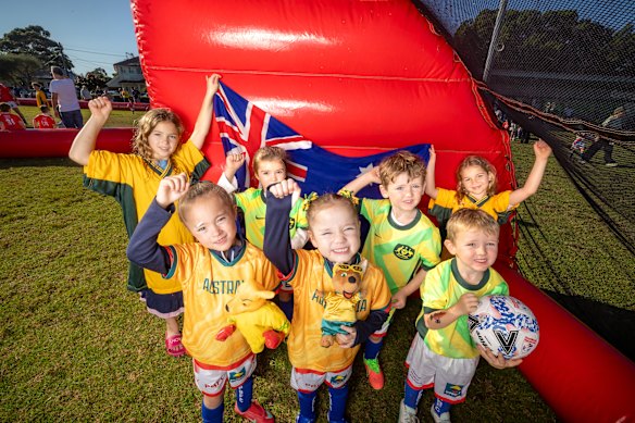 Pagewood FC’s Juliet Kacen, Keeley Hughes, Ada Nesbitt, Harper Hughes, Mason Pierce, Jesse Pierce and Allie Kacen throw their support behind the Socceroos ahead of their opening match against Turkiye.