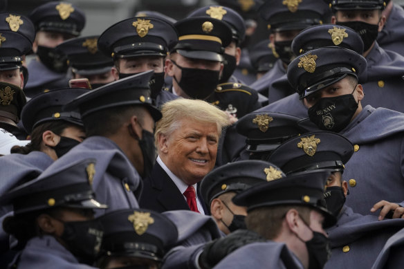US President Donald Trump, who has refused to accept the election result, is surrounded by Army cadets as he watches the 121st Army-Navy Football Game at the United States Military Academy in West Point, New York. 