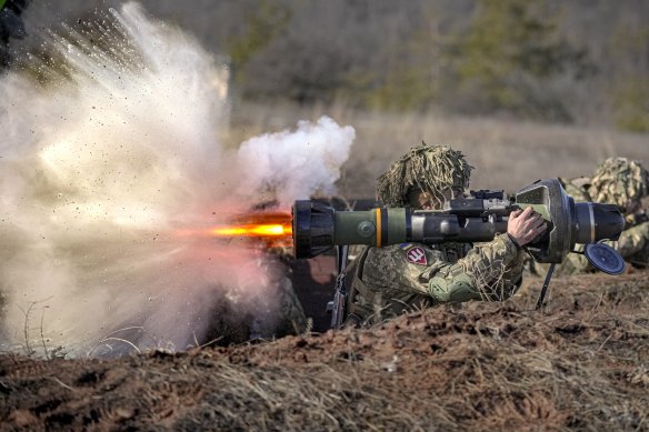 A Ukrainian soldier fires an anti-tank weapon in eastern Ukraine.