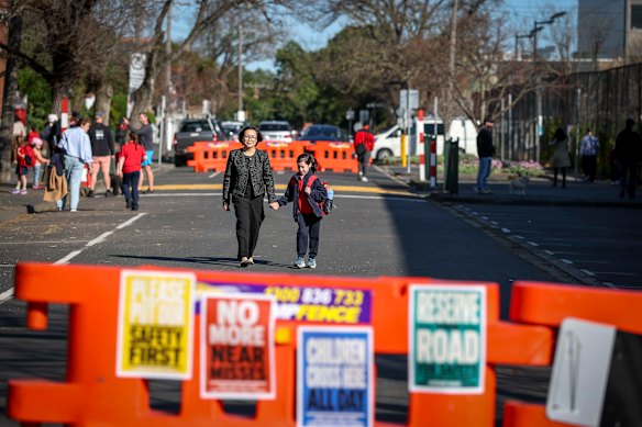 Elaine Ko and daughter Alexan are among Camberwell Primary School parents and students who support a controversial push to permanently close Reserve Road, just outside their school near Camberwell Junction.