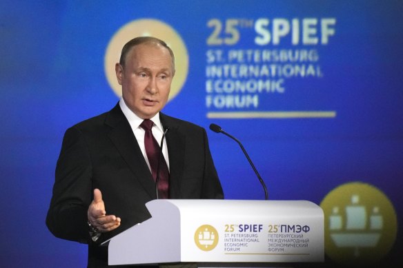 Russian President Vladimir Putin gestures as he addresses a plenary session of the St Petersburg International Economic Forum.