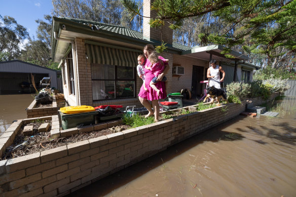 Aimee and Chris Lindrea and their children at their Rochester home on Tuesday.