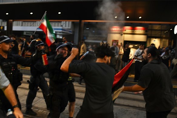Protesters clash with police near Town Hall in February during Israeli President Isaac Herzog’s visit to Sydney.
