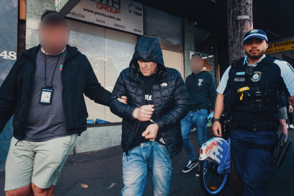 Peter Taylor was arrested at a Sydney CBD hotel during Amarok Raids last year and was taken to a police van.