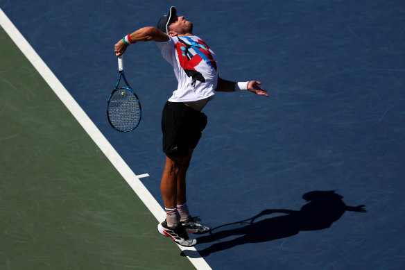 James Duckworth fires a serve down during his second-round clash with Dan Evans.