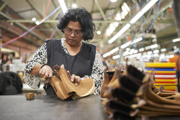 A worker at the expanded RM Williams factory in Salisbury, Adelaide, which now has a dedicated production line for women’s boots.