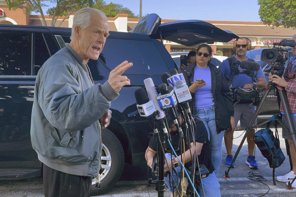 Former Trump White House official Peter Navarro speaks to reporters before he heads to prison in Miami to begin serving his sentence for refusing to cooperate with a co<em></em>ngressional investigation into the January 6, 2021 attack on the US Capitol.