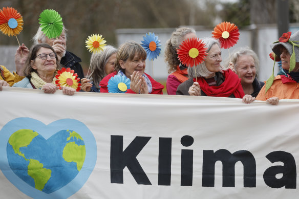 People demonstrate outside the European Court on Wednesday, when a group of Swiss retirees took their government to the top European court for failing to take stronger action on climate change. 