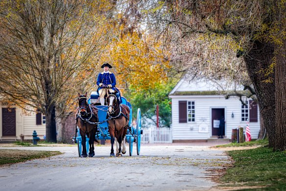 A horse-drawn carriage on the streets of Colonial Williamsburg.