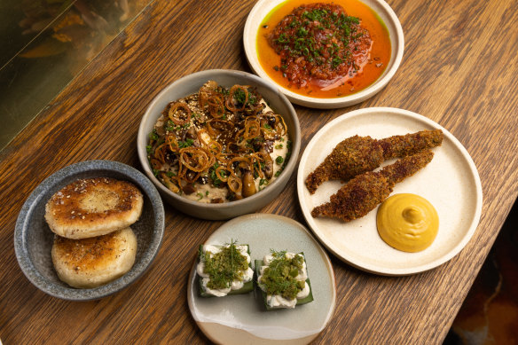 Maha flatbreads; hummus, baharat and mushrooms; Victorian tuna, Turkish chilli, preserved lemon, fermented capsicum, pickled onion; fried zucchini flowers, pumpkin and zaatar; pickled cucumber, labneh, anchovy and green olives.