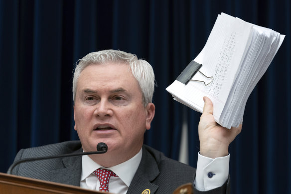 House Oversight and Accountability Committee Chairman Representative James Comer waves papers.