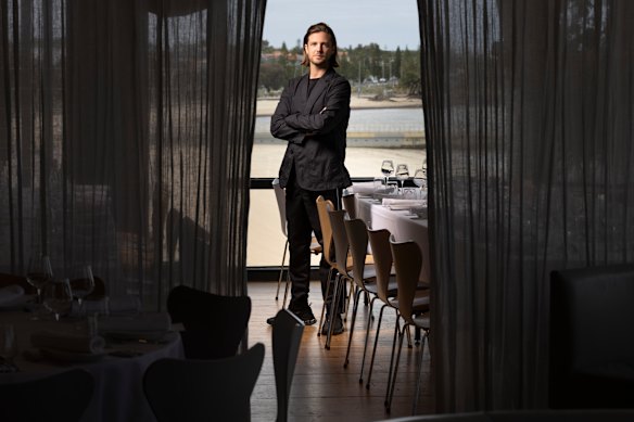 Dramatic black curtains but a familiar beach view: Hugh Van Haandel says his venue is still the “quintessential Australian beach house”.