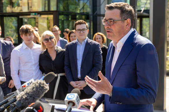 Daniel Andrews’ wife, Cath, and children watch as he announces his resignation. 