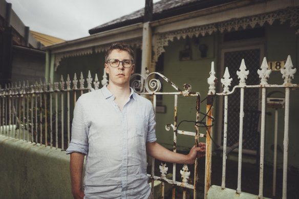 Sydney YIMBY co-founder Justin Simon outside a house in Glebe that is part of a heritage conservation zone.