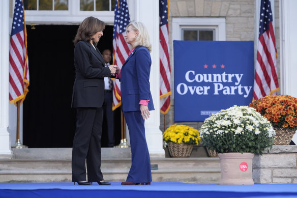 Liz Cheney welcomes Kamala Harris to stage at the rally in Ripon, Wisconsin.