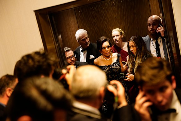 Agents usher people from the Washington Hilton after gunshots were fired in the lobby.