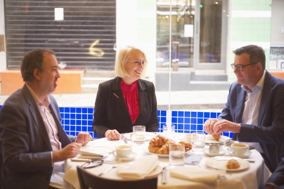 Victorian Premier Daniel Andrews (left) with Melbourne Lord Mayor Sally Capp and Tourism Minister Martin Pakula on Sunday.