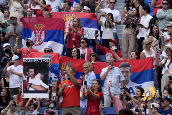 Serbian fans watch Novak Djokovic.