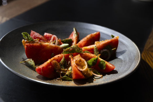 Heirloom tomatoes, with pine nuts and oregano.