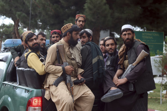 Taliban fighters arrive inside the Hamid Karzai International Airport after the U.S. military’s withdrawal from Kabul.