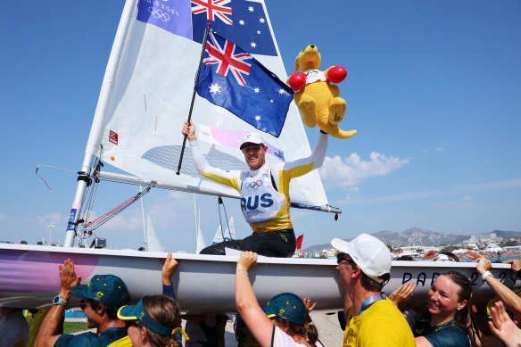Matt Wearn’s teammates and support crew carried him back to shore aboard his boat like and all-conquering Viking warrior.  