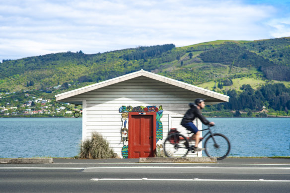 Picture perfect … Cycling past colourful boat sheds.