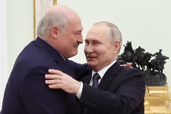 Belarusian President Alexander Lukashenko and Russian President Vladimir Putin embrace at the Kremlin last month.