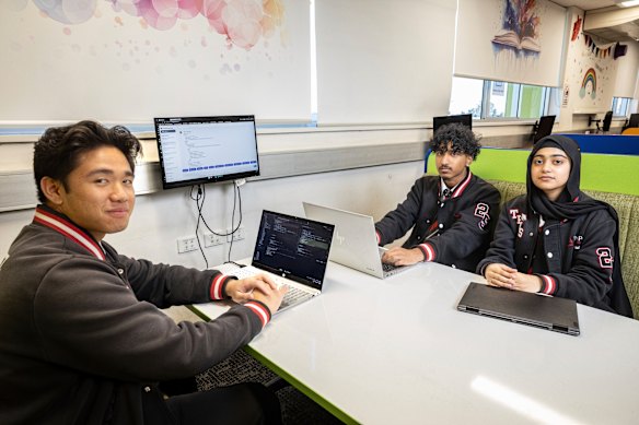 Year 12 students at The Ponds High School, Xavier Martinez, Aarush Veloremahender, and Zuha Nadeem, explore artificial intelligence tool NSWEduChat. 