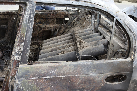 Rocket launcher tubes are seen inside a destroyed vehicle in Kabul, Afghanistan, on Monday, August 30.