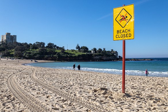 A beach closure sign at Coogee Beach in the hours after Leah Stewart was attacked on June 13.