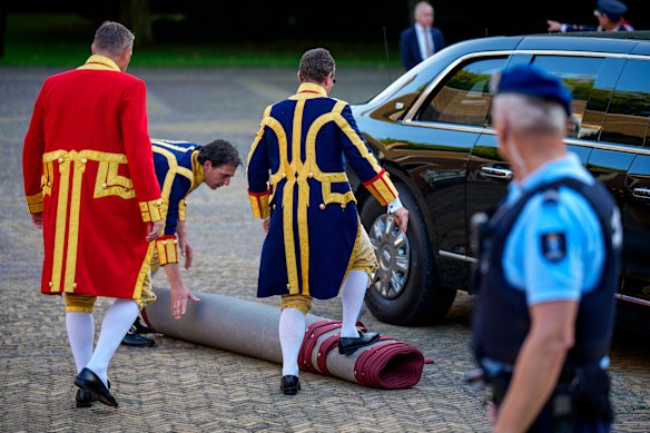 Huis ten Bosch Palace staff roll up the red carpet used to welcome US President Donald Trump.