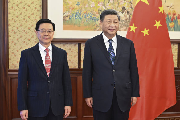 Hong Kong CEO John Lee (left) with Chinese President Xi Jinping: the city’s proposed counterespionage laws are echoing those of the mainland. 