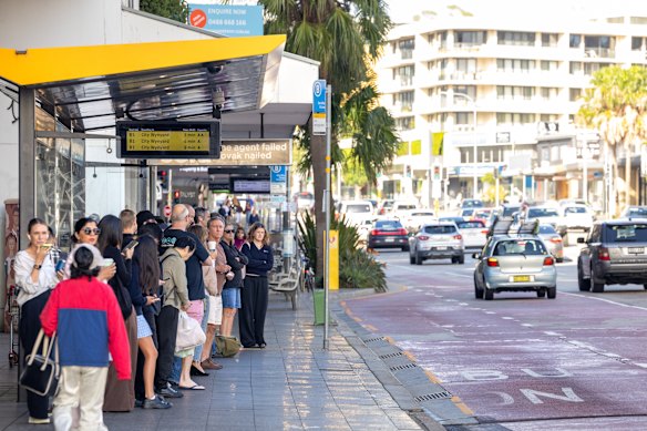 Commuters queue for a B-line bus at Dee Why on Monday morning.