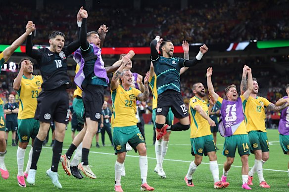 Australian players celebrate after the win over Turkey.